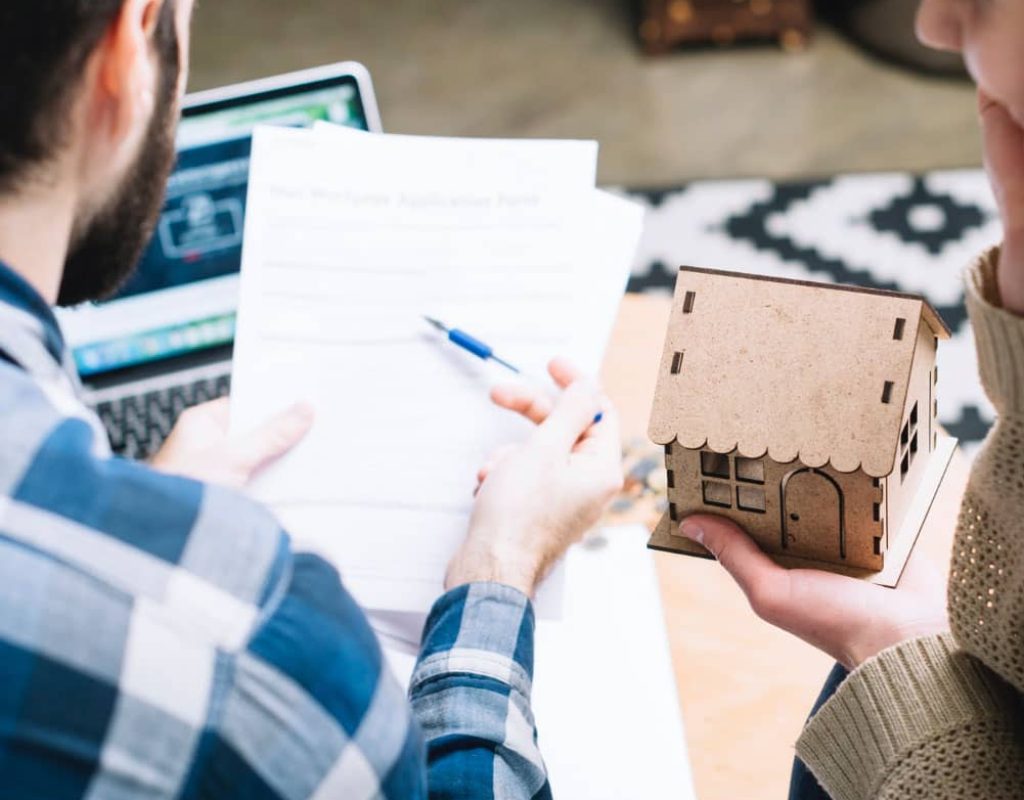 Sold sign in front of a house sold fast for cash